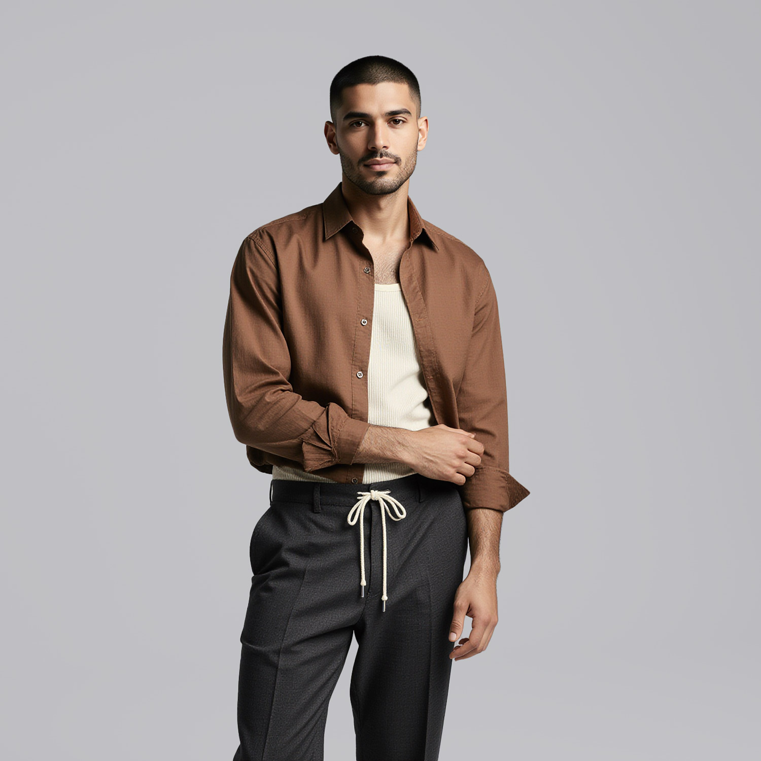 Man wearing lightweight button-down and tailored trousers representing Sudsies dry cleaner near Edgewater Miami