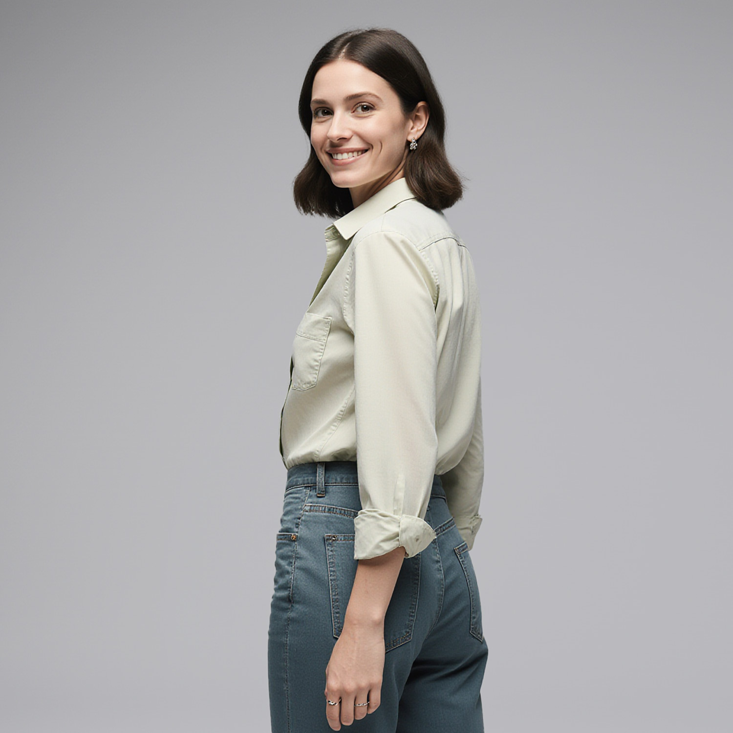 Woman wearing casual blouse and jeans styled for Sudsies dry cleaning near Las Olas